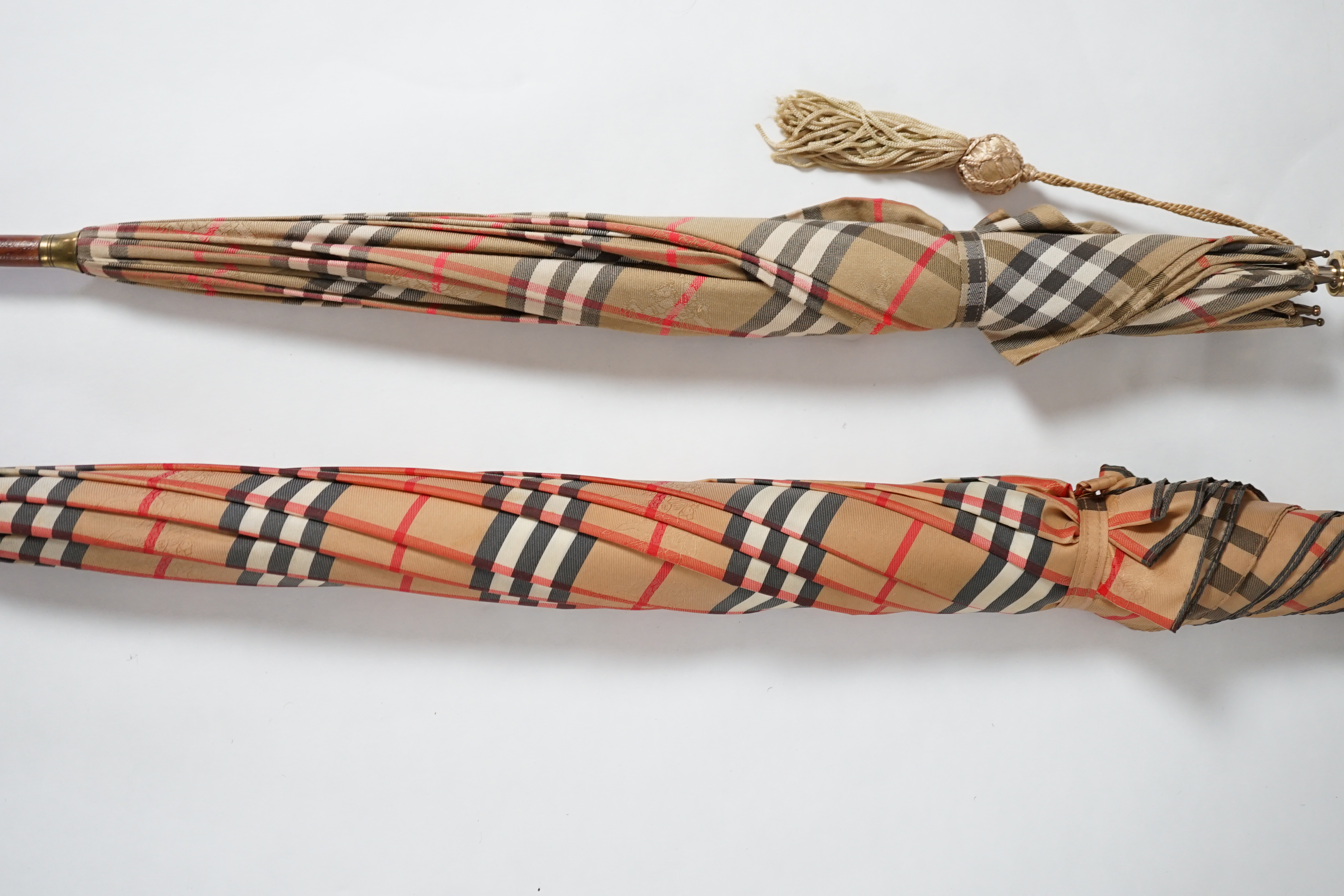 A vintage Burberry shooting stick umbrella and a lady's vintage cotton umbrella, shooting stick height 91cm, umbrella 83cm